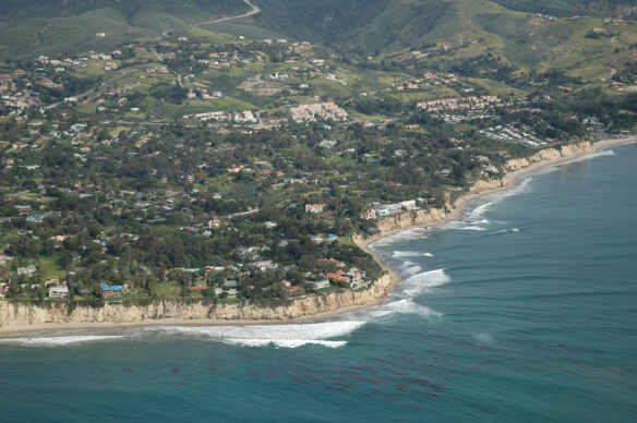 Wave refraction as wave crests wrap around a point near Malibu, in southern California (Photo © Bruce Perry).