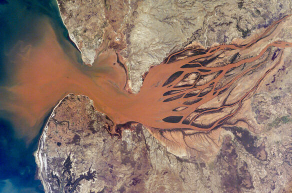 A river delivers large quantities of sediment to the coastal waters of Madagascar (Photograph courtesy of NASA).