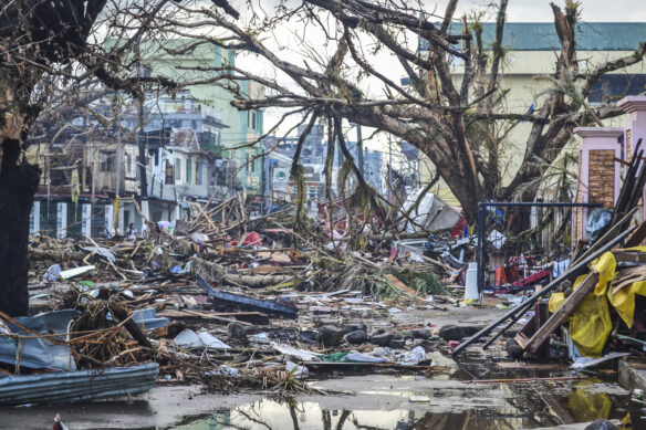 Damage from super typhoon Haiyan (Yolanda) in Tacloban City, The Philippines, 2013 (Photograph by Eoghan Rice - Trócaire / Caritas licensed under CC BY 2.0 via Flickr).